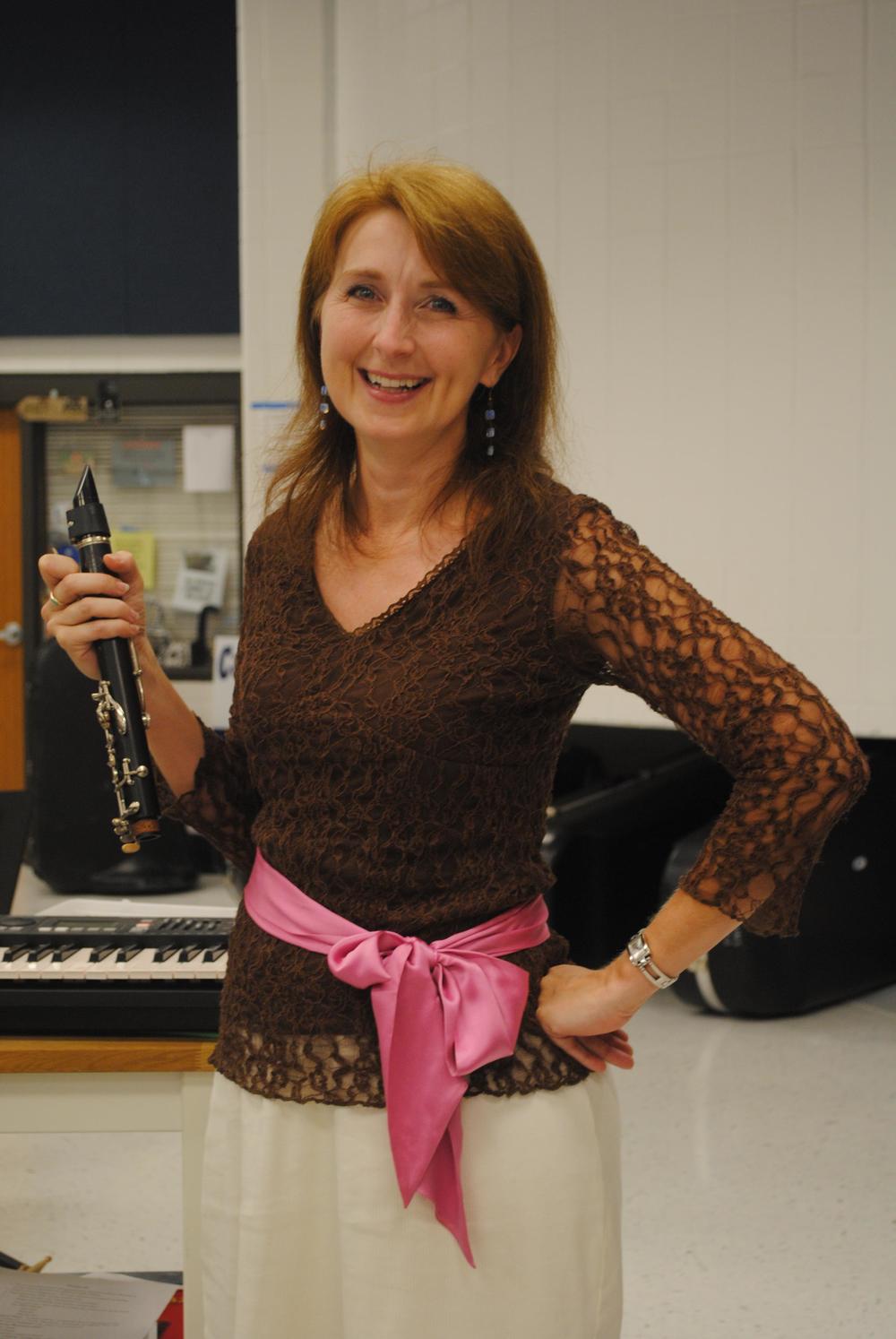Mrs. Ward demonstrates the clarinet to students. Photo by Maya