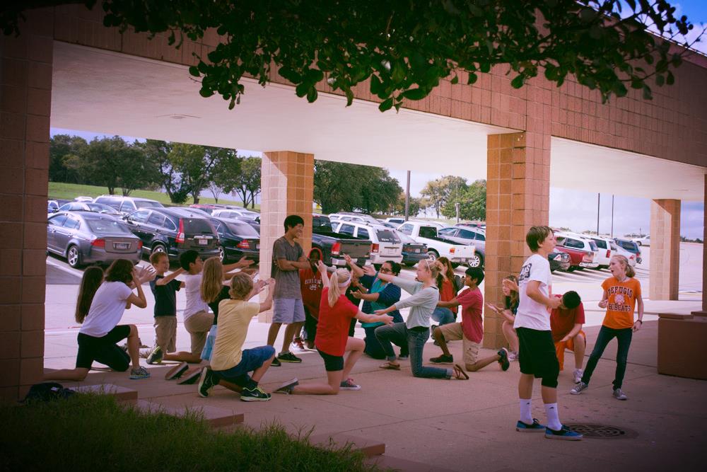 Mr. Abrams' theatre class also performed their flash mob under the bus canopy. Photo by Torrey