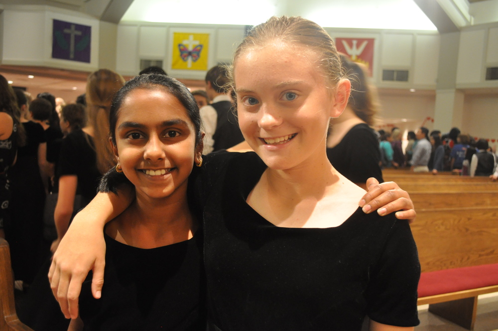 Seventh graders Pooja E. and Elizabeth D. enjoy singing in choir. Photo by Katie