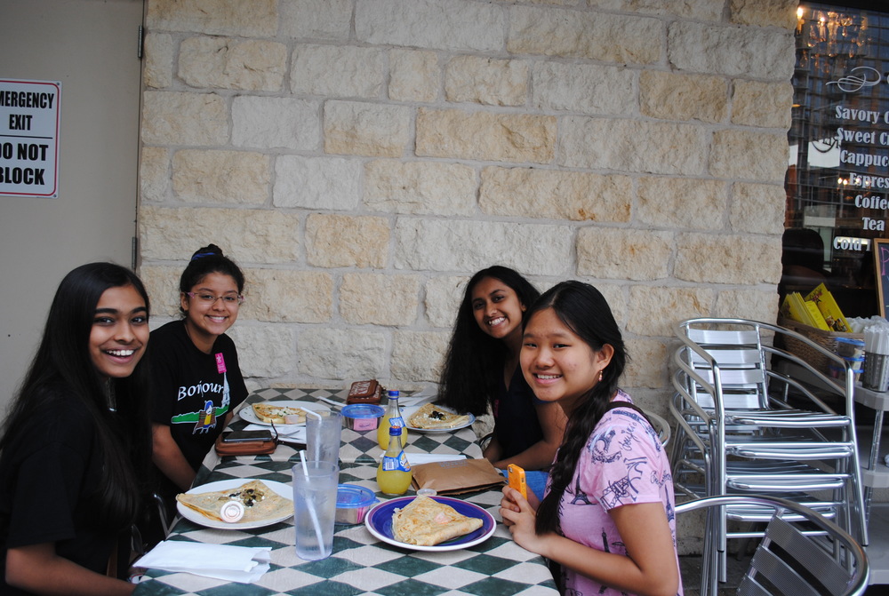 8th graders Aneesha Kambhampati, Sara Miranda, Bianca Widjaja, and Gauri Pargaonkar enjoy savory crêpes at Le Café Crêpe. Photo by Jenny Xu