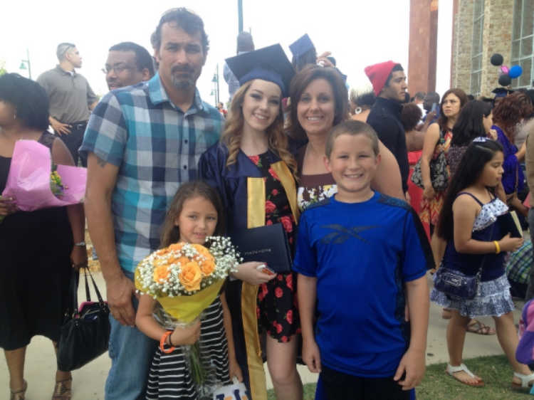 Mrs. Cerezo and her family at her daughter's graduation. Photo from personal collection