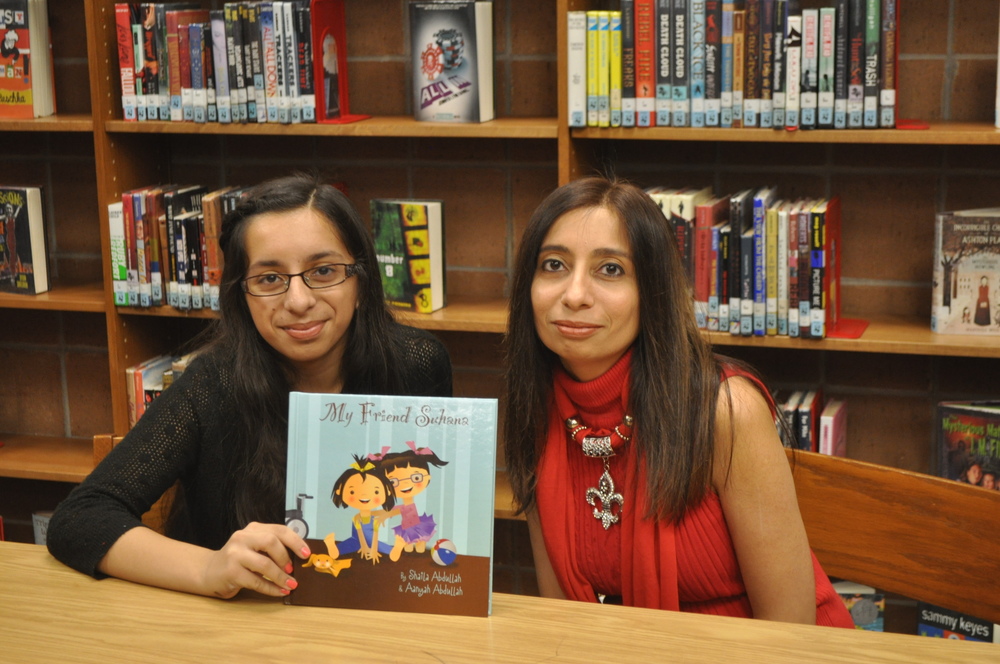 Aanyah Abdullah and her mother, Shaila Abdullah holding their book, 