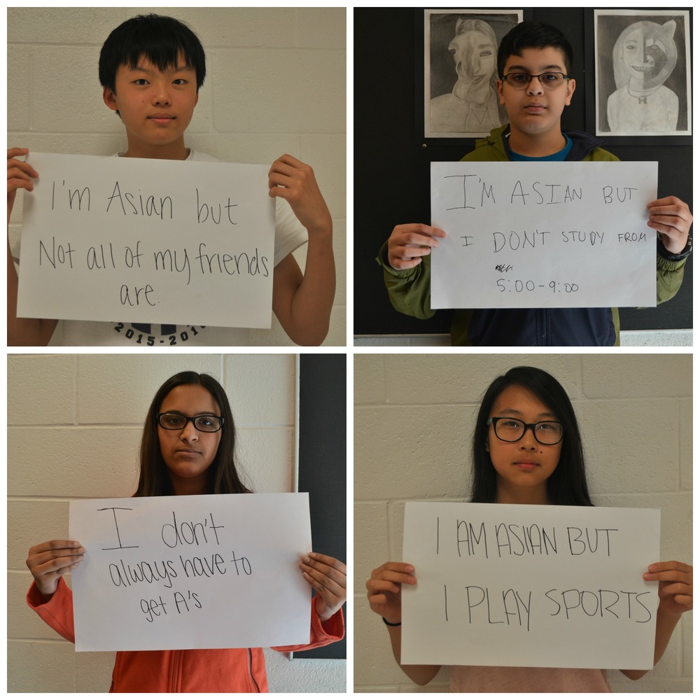 7th graders Glen Liu and Sunny Lee and 8th graders Nikhil Lyles and Reefa Maridia hold up signs with what they want to say against the stereotypes. Photos by Hannah Lu and Michelle Lee