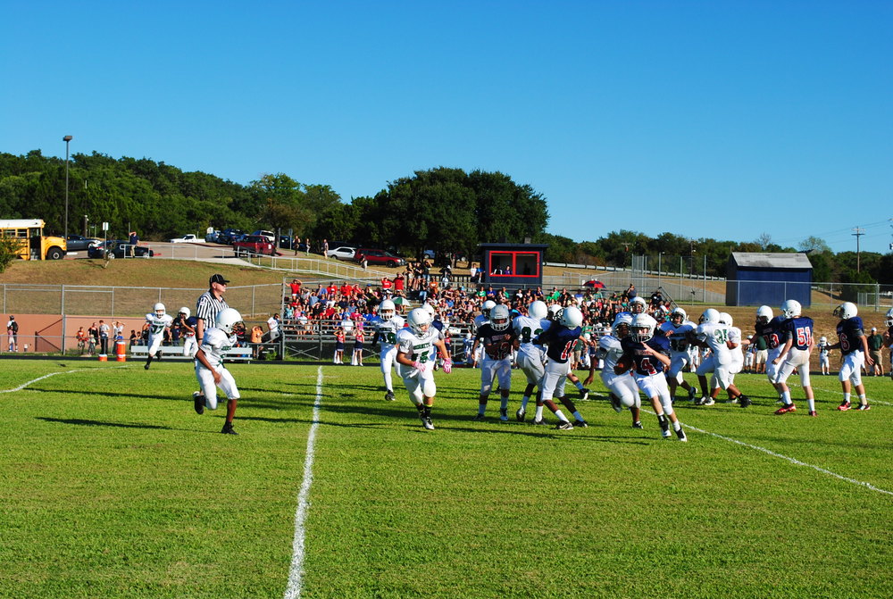 Quarterback Harrison Jaeger running the ball against Hopewell. Photo by Arjun Seth.