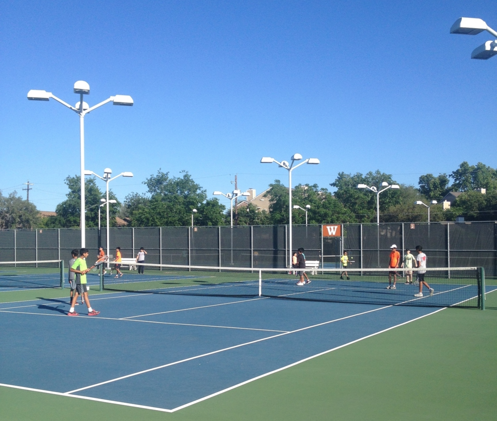 Students warming up on the Westwood tennis courts during the beginning of practice. Photo by Grace Liu