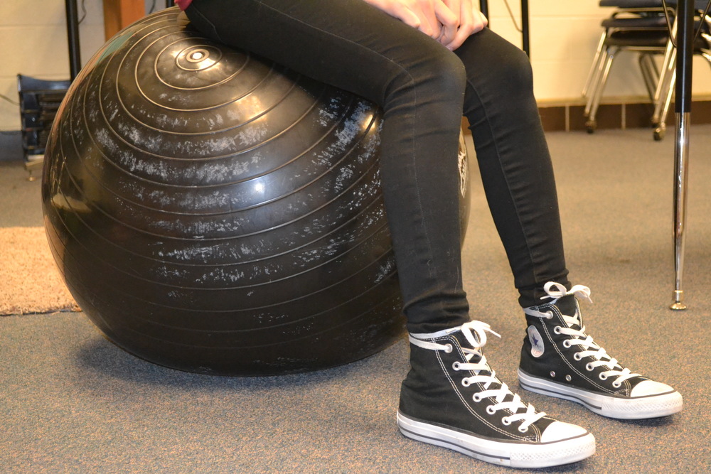 8th grader Victoria Chandler on a stability ball in Mr. Waghorne's room. Photo by Bailey Armosky.