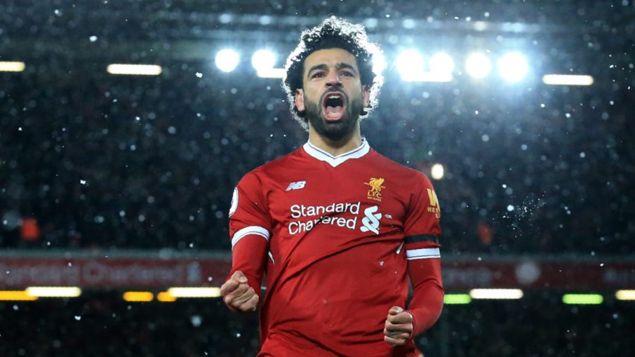 Liverpool's Egyptian midfielder Mohamed Salah celebrates scoring the fourth goal during the English Premier League football match between Liverpool and Watford at Anfield in Liverpool, north west England on March 17, 2018. / AFP PHOTO / Lindsey PARNABY / RESTRICTED TO EDITORIAL USE. No use with unauthorized audio, video, data, fixture lists, club/league logos or 'live' services. Online in-match use limited to 75 images, no video emulation. No use in betting, games or single club/league/player publications.  /         (Photo credit should read LINDSEY PARNABY/AFP/Getty Images)