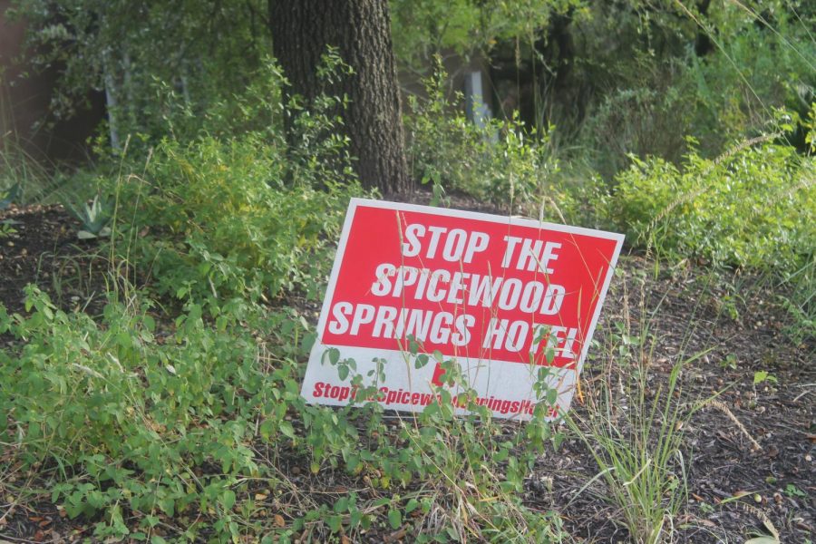 Many people have these red signs in protest of the Spicewood Springs Hotel. You may have seen them last year put up near the school. 