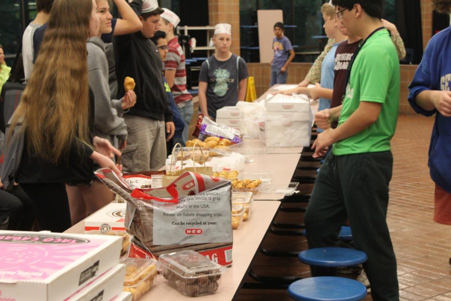 a table was set up and filled with various foods brought by the students