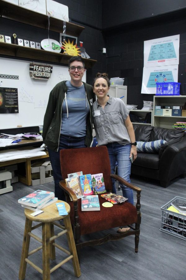 (Left to right) Amber Jonker and Elizabeth Simmons in front of the LGBTQIA+ books donated.