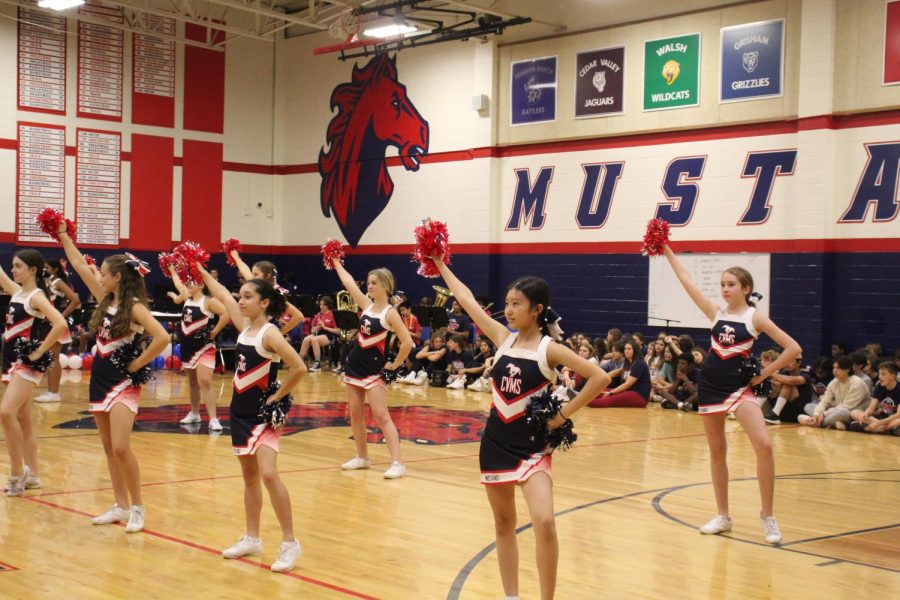 The cheerleaders performing during the 8th grade pep rally