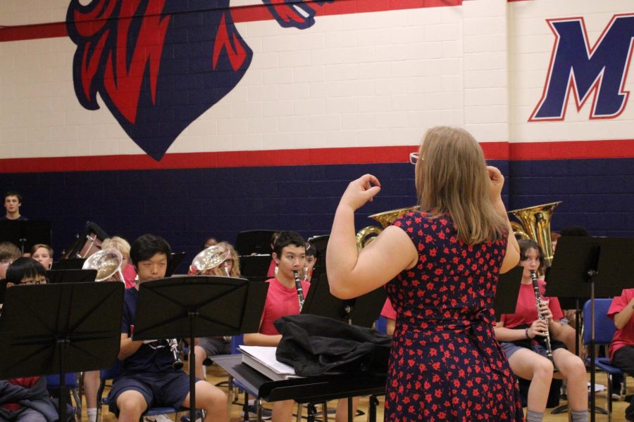Miss Stehn, one of the band directors conducting the band during the 6th grade pep rally