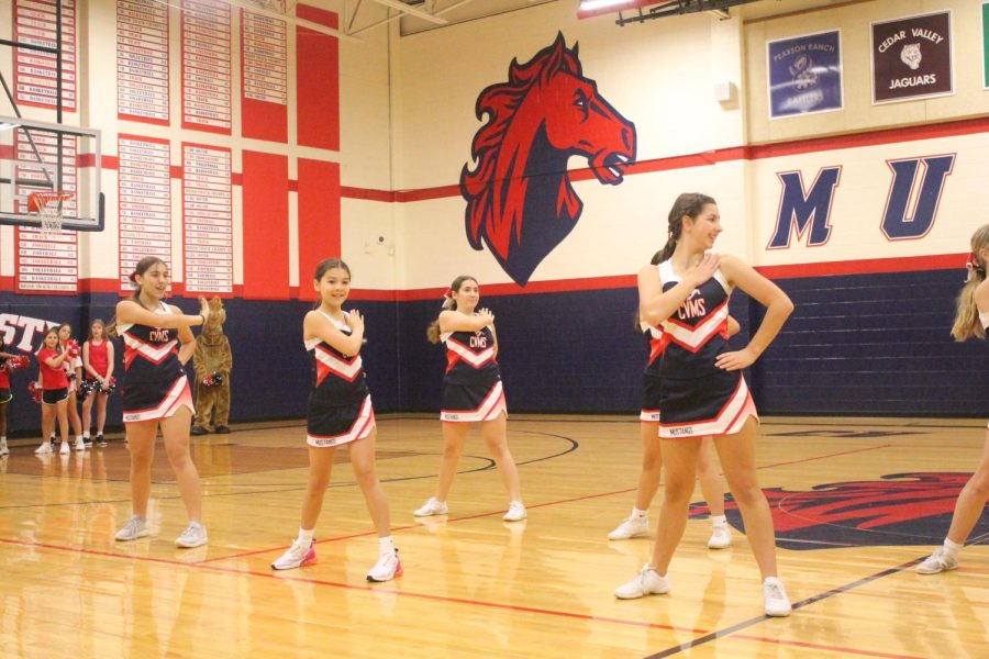 The cheerleaders performance at the Mustang Express pep rally